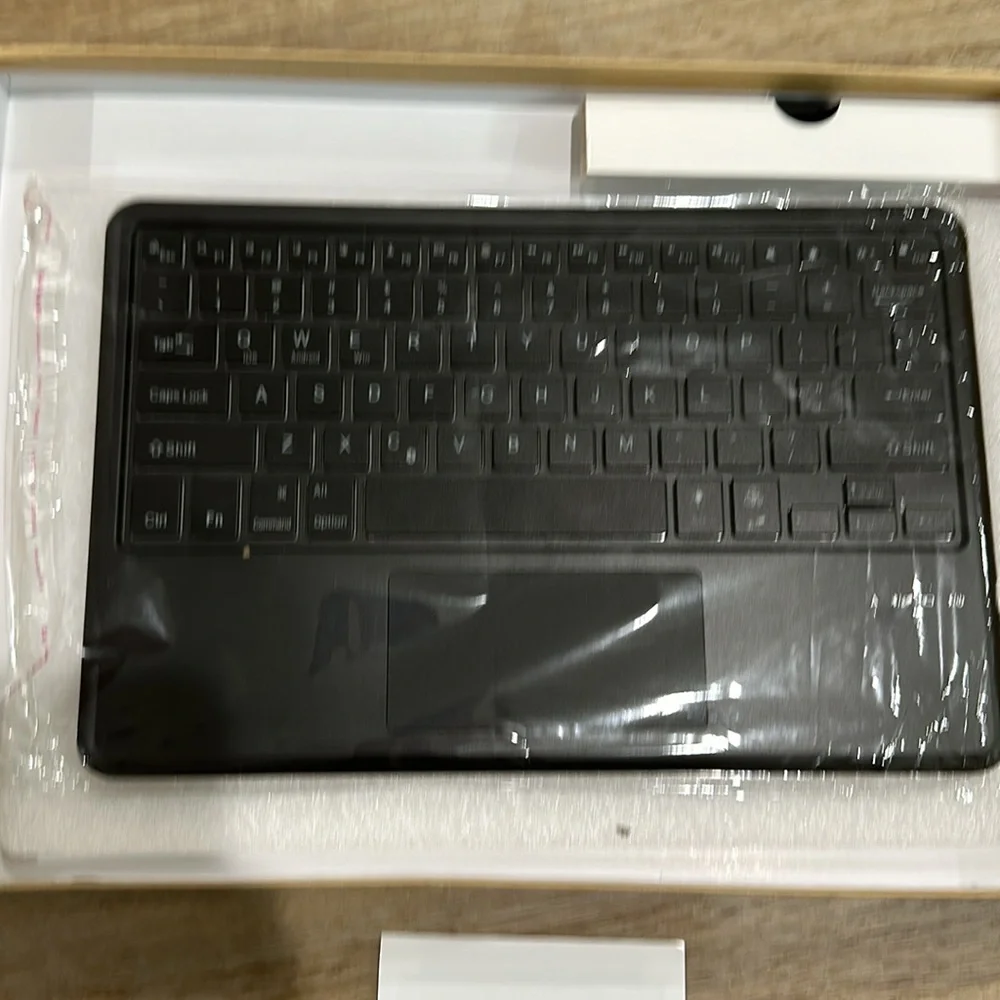 NWT Bluetooth keyboard with backlight. Works with 3 systems